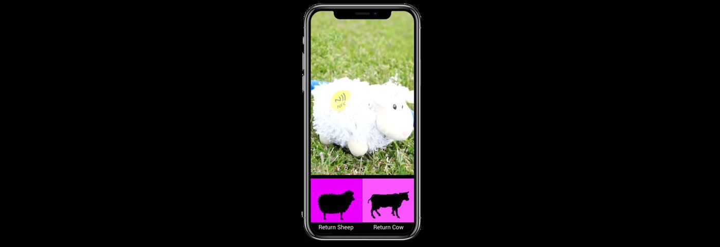 A child scanning an NFC-tagged plush sheep during a BrainQuest game on the school playing field