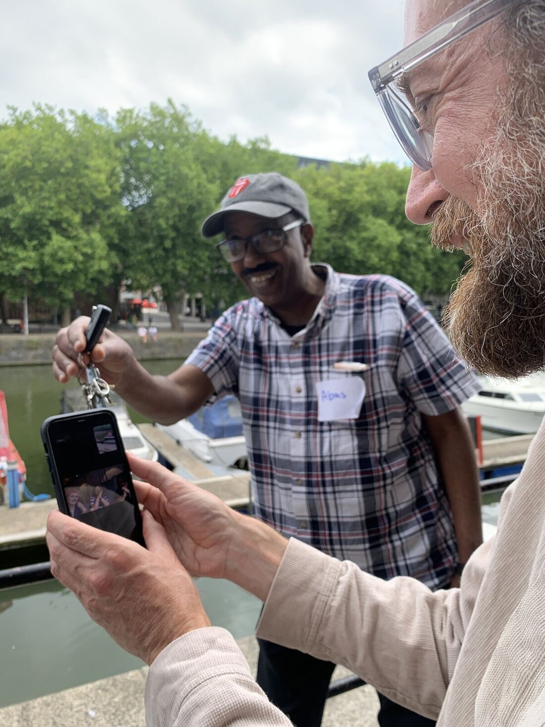 A co-researcher working with personal photographs and printed prompts