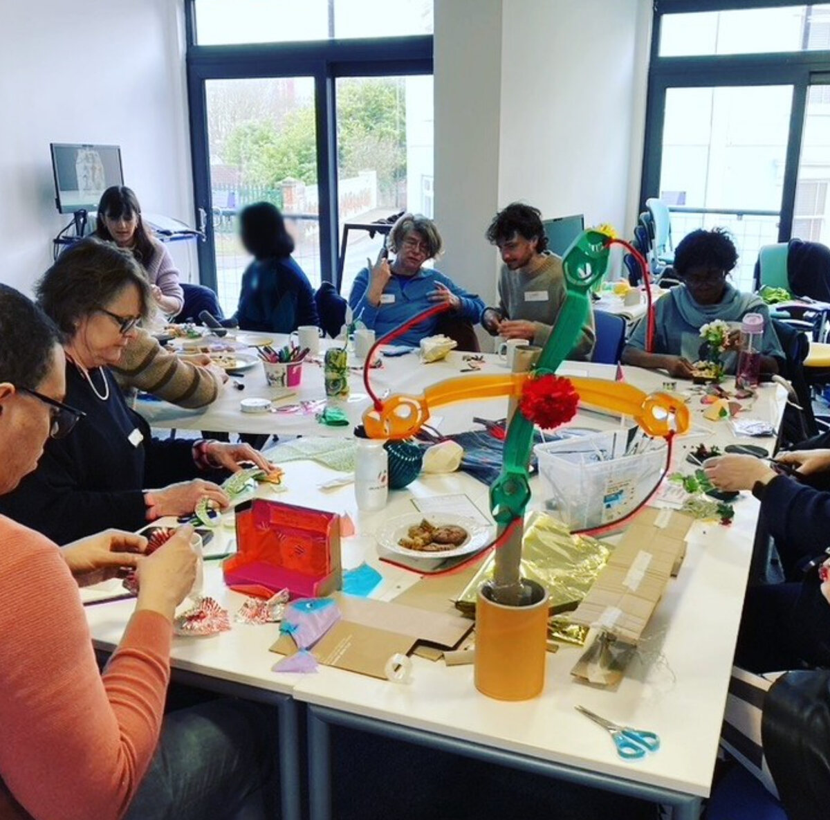 Co-researchers gathered around a table during a Connecting Through Culture workshop